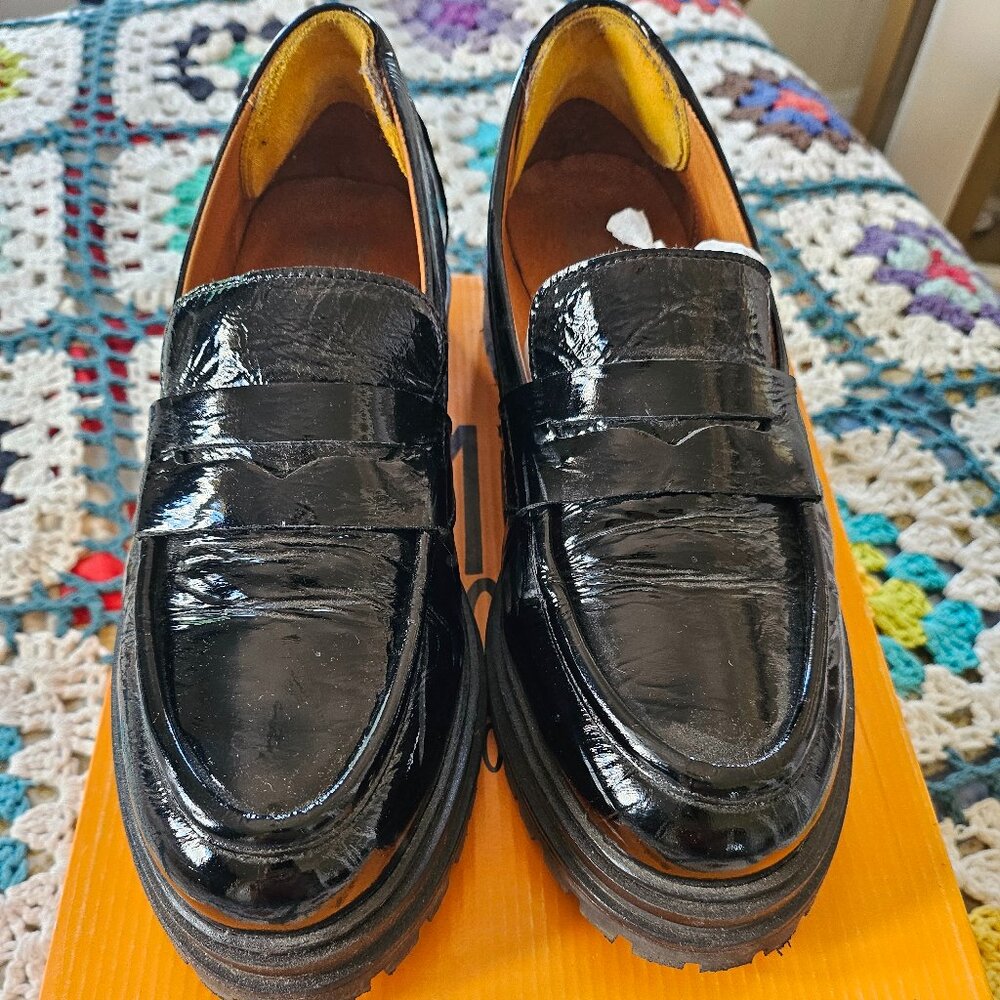 Shiny black loafers